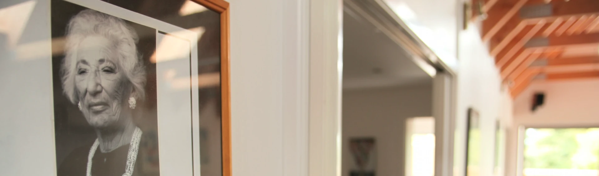 Raye Freedman's framed portrait in the hallway at 788 Remuera Road